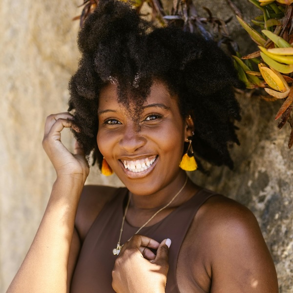happy woman who has stopped people pleasing