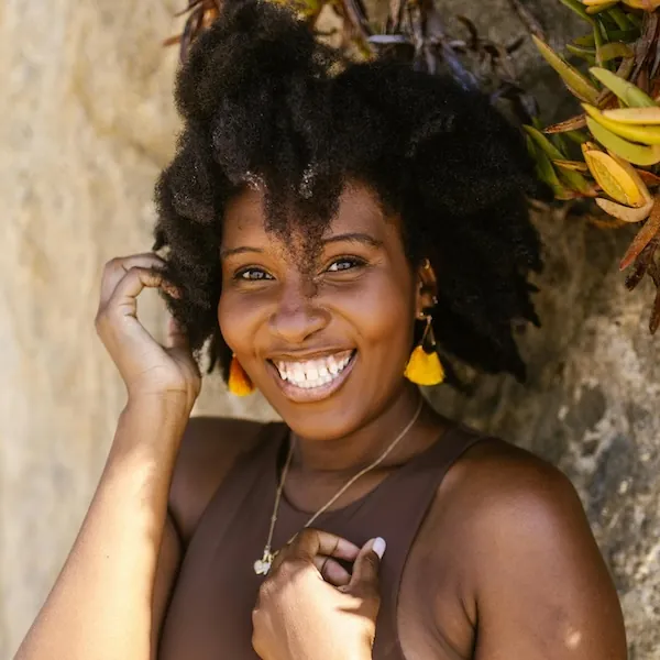 happy woman who has stopped people pleasing