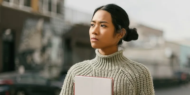 serious woman thinking about her fawning trauma response